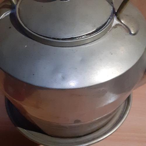 18 - Metal teapot on stand. Shows makers marks on base so possibly silver plate. Wooden handle. Some age ... 