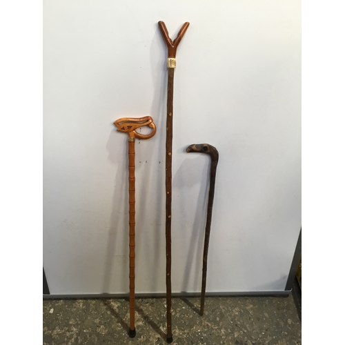 265 - Trio of ornately carved design walking sticks