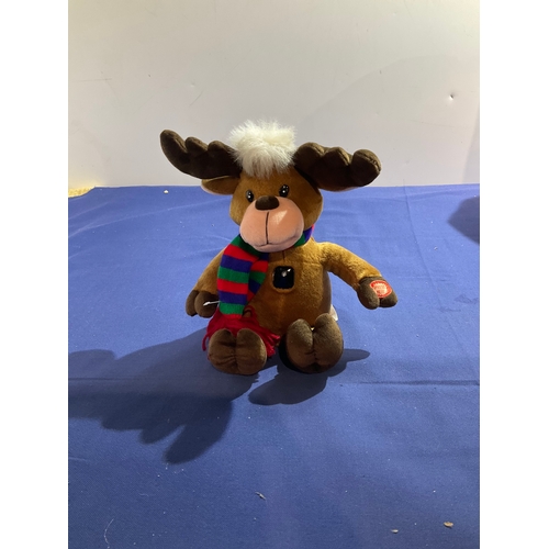 99 - Plush singing Reindeer in good condition working