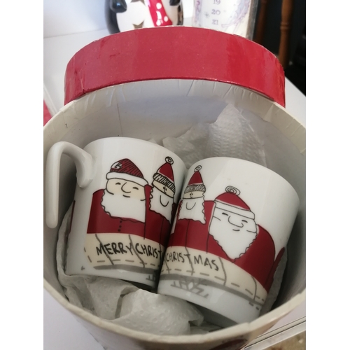 10A - Box of various Christmas items including 2 packs of tags, Advent candle, mugs and 2 Rolybear figurin... 