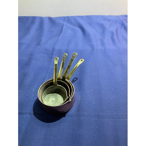 162 - Set of brass and copper measuring cups