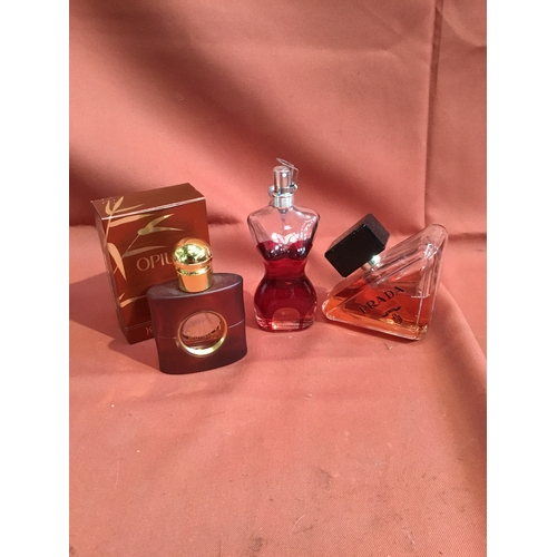 216 - Selection of ladies part used Parfume including Prada Milano, Opium by Yves Saint Laurent, and one o... 