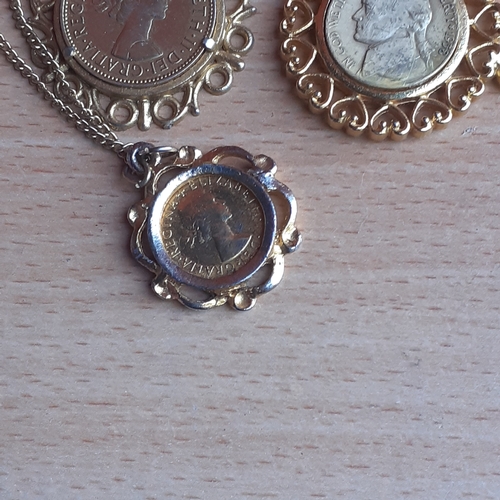 18 - Three decorative gold coloured coin pendants. Individual coins with decorative surround. 1967 Halfpe... 