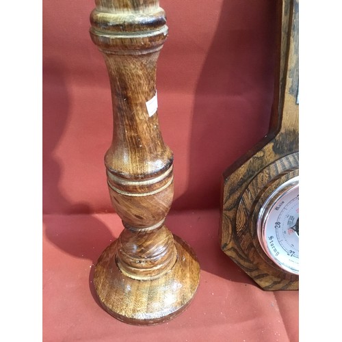 244 - Pair of wooden candle holders and oak cased barometer