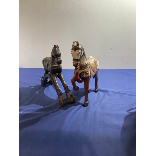 101 - 2 wooden decorative horses one with brass detailing