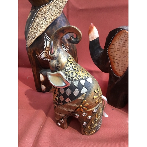 196 - Three decorative wooden elephant ornaments