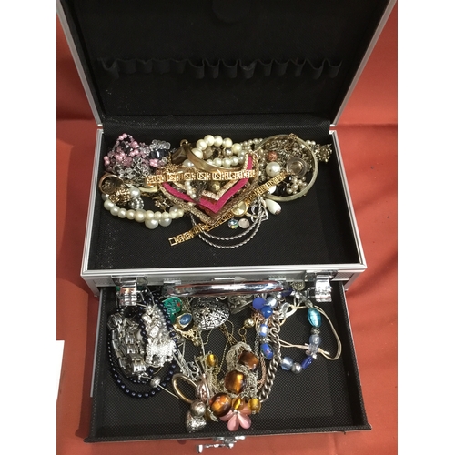 208 - Metal case with selection of costume jewellery