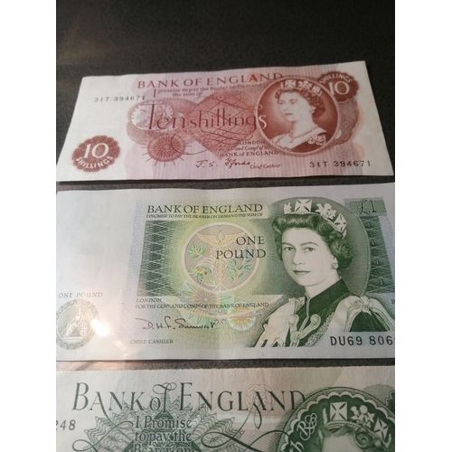 23A - 3 x old English banknotes 2 x 1 pound notes and a 10 shillings note all in excellent condition