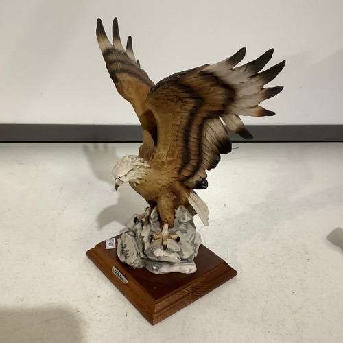 48 - A Belcori large collectible eagle on wooden plinth