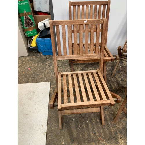 151 - 4x folding teak wooden garden chairs