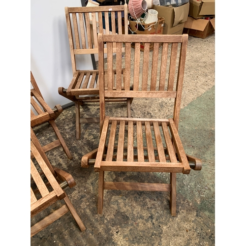 151 - 4x folding teak wooden garden chairs