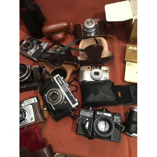 157 - Quantity of vintage cameras inc Canon, Optima, Zenit EM and more