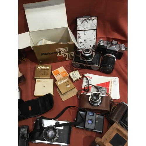 157 - Quantity of vintage cameras inc Canon, Optima, Zenit EM and more