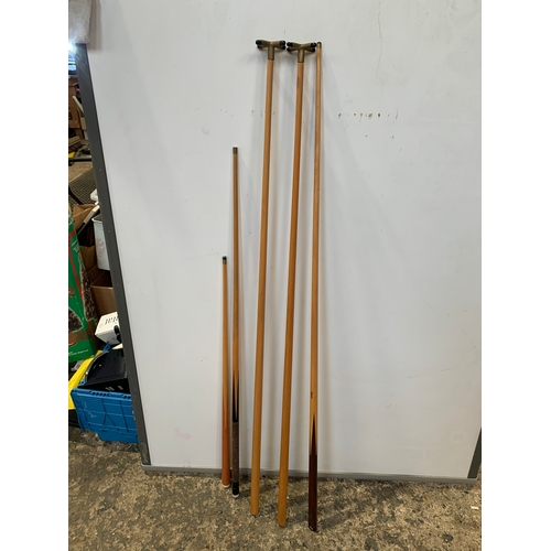 276 - Quantity of short snooker cues and cue rests with brass ends