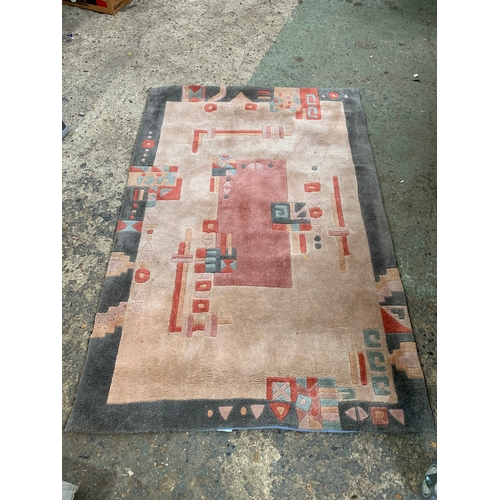 293 - Floor rug in good condition - 120x180cm