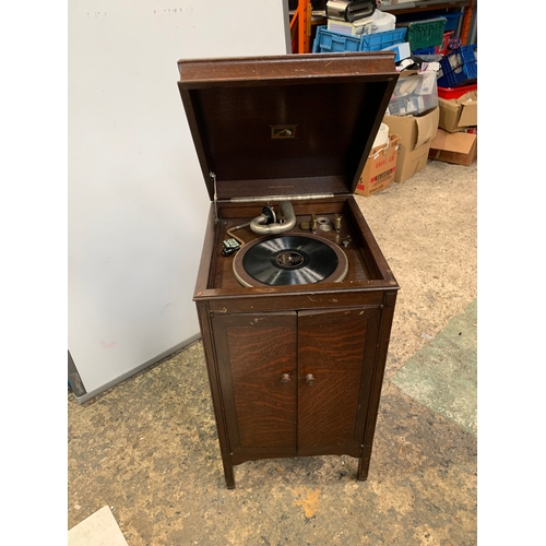 301 - His Masters Voice gramophone in oak case with cartridge and handle