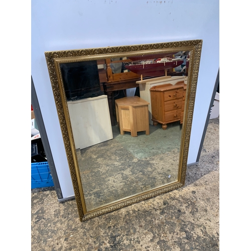 323 - Two large gold gilt mirrors - largest being 120x90cm