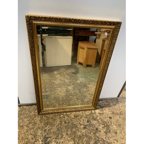 323 - Two large gold gilt mirrors - largest being 120x90cm