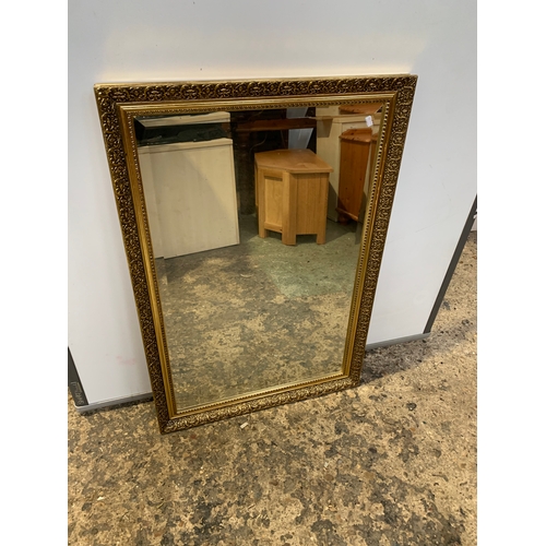 323 - Two large gold gilt mirrors - largest being 120x90cm