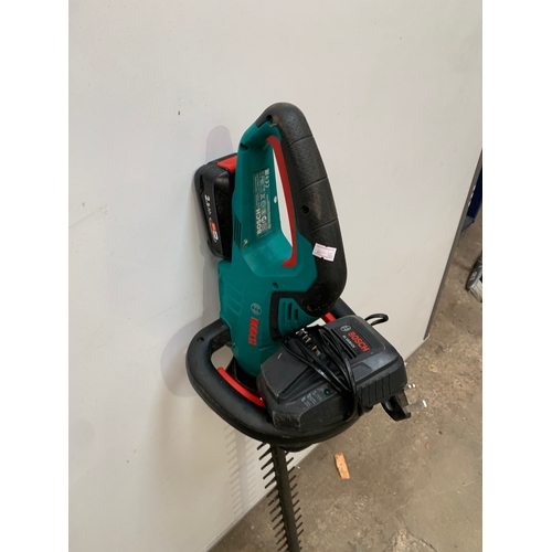 393 - Bosch cordless hedge trimmer with charger - working