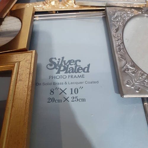 18A - Large quantity of smaller size picture frames. Various designs, including silver plate, wood and bra... 