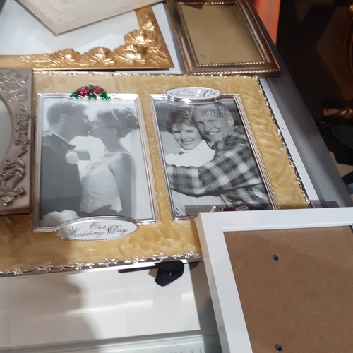 18A - Large quantity of smaller size picture frames. Various designs, including silver plate, wood and bra... 