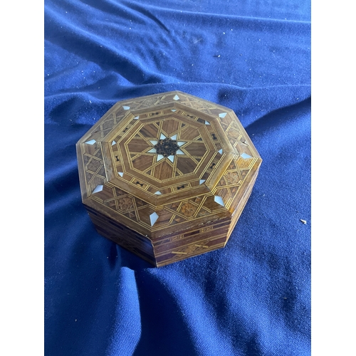 168 - Large quantity of foreign coins and notes in wooden marquetry inlayed wood box