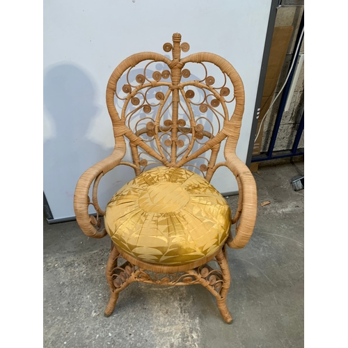 483 - Peacock style rattan wicker armchair with cushion