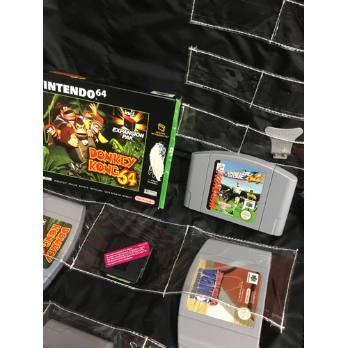 187 - Nintendo 64 bag with Gamester LMP controller and a selection of Nintendo 64 games to include War zon... 