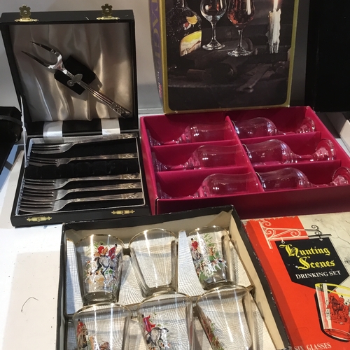 82 - Collection of forks in cases, sherry glasses drinking set and more