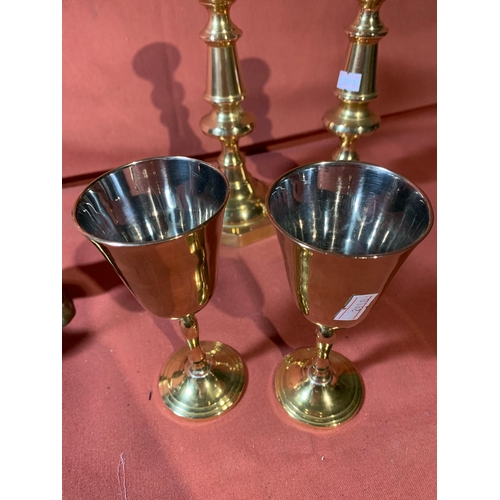 21 - Brass Pair of candle sticks 24cm, Pair of Goblets 16 cm and 2 Swans 1 x 23 cm & 1 x 16 cm