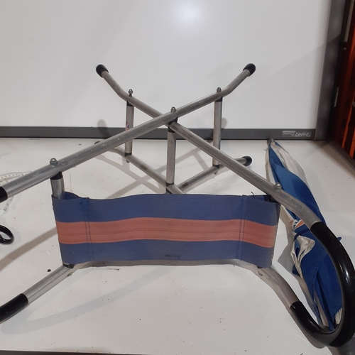 10 - Aluminum framed fishing seat and Gulf umbrella. Seat marked Mercedes Benz and both good condition bu... 