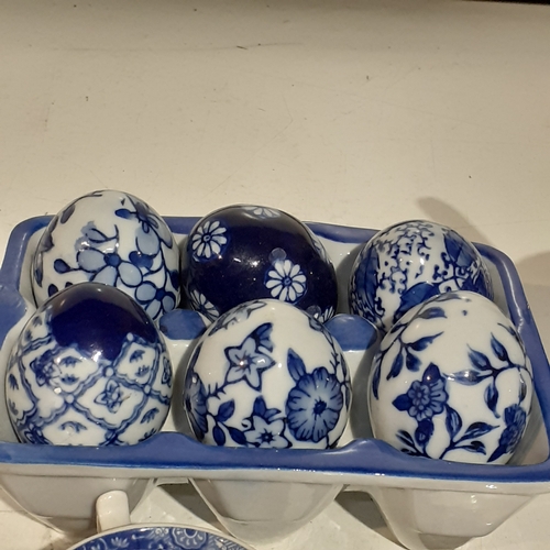 11 - Blue/White lot. Includes Sadler teapot, Spode cup & saucer etc and 6 decorative eggs in holder. Attr... 