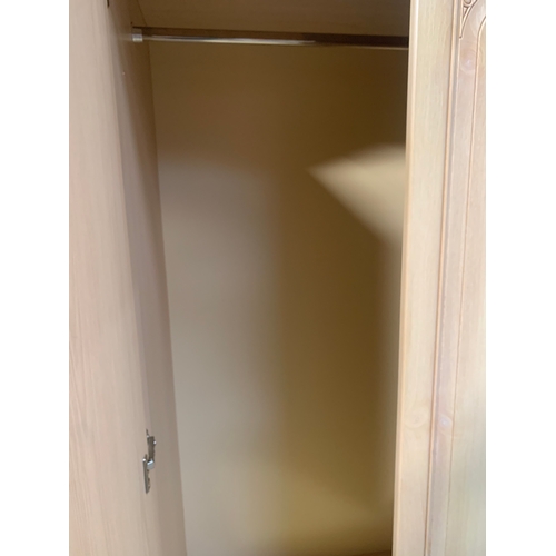 190 - Light wood effect wardrobe 2 door with 2 drawers under. Decorative pattern to the doors