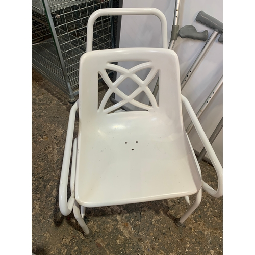 197 - Mobility bathroom chair, a pair of crutches and walking sticks