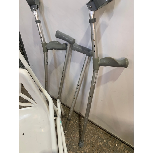 197 - Mobility bathroom chair, a pair of crutches and walking sticks