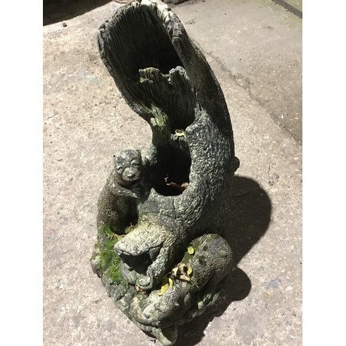 351 - Concrete garden ornament depicting 2 otters with hollow tee stump