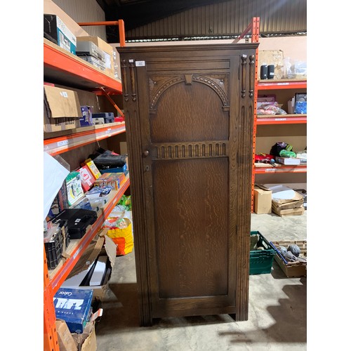 337 - Dark wood hall cupboard with decorative detail and key