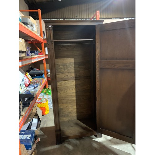 337 - Dark wood hall cupboard with decorative detail and key