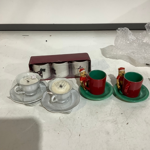 654 - Pair of Winnie Pooh espresso cups and candles