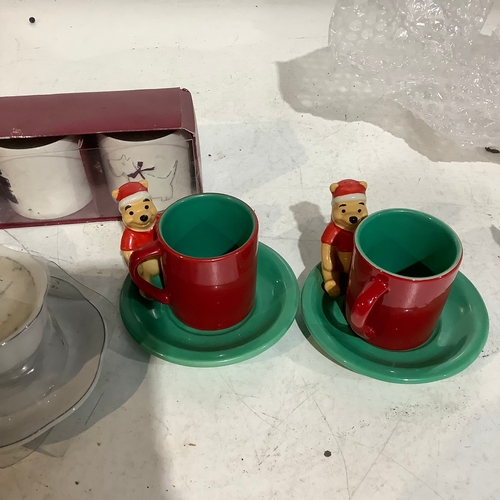 654 - Pair of Winnie Pooh espresso cups and candles