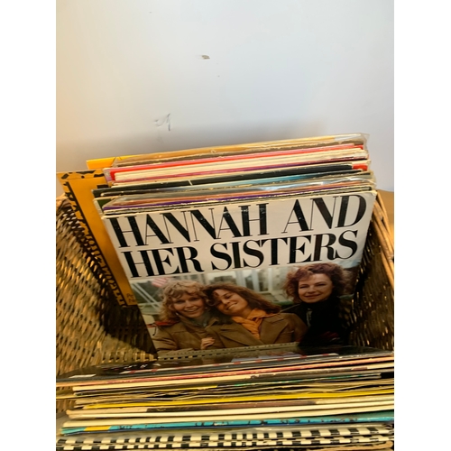 710 - Wicker basket with selection of vinyl records