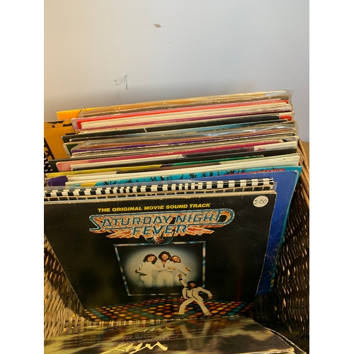 710 - Wicker basket with selection of vinyl records