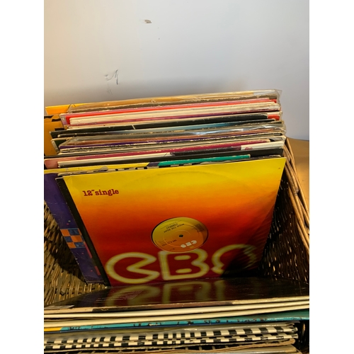 710 - Wicker basket with selection of vinyl records