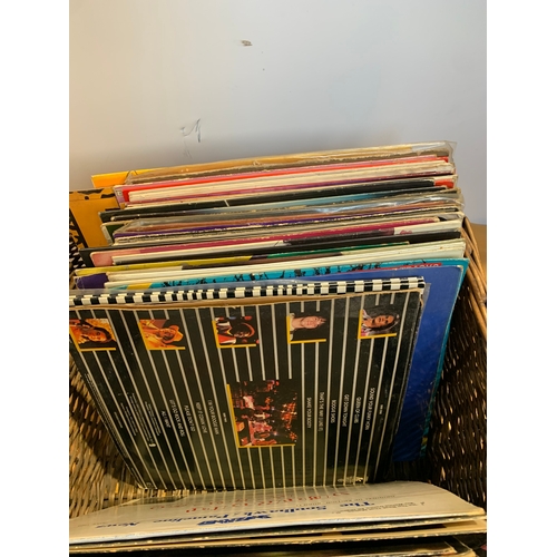 710 - Wicker basket with selection of vinyl records