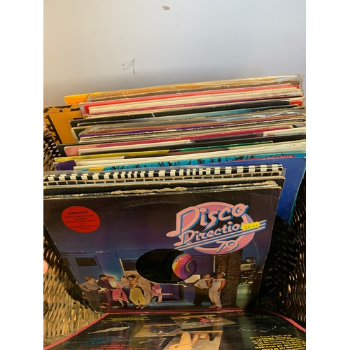 710 - Wicker basket with selection of vinyl records