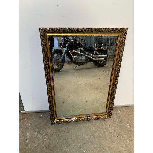 730 - Large mirror in intricate gold frame