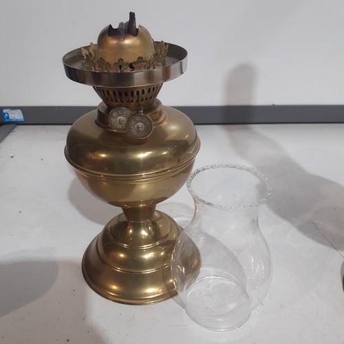 158 - Brass, double wick oil lamp. With glass chimney. UK made.