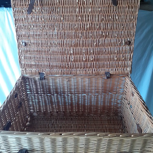 14 - Large lidded wicker basket. Leather handles and straps with buckles. Brass retaining chains for lid.... 