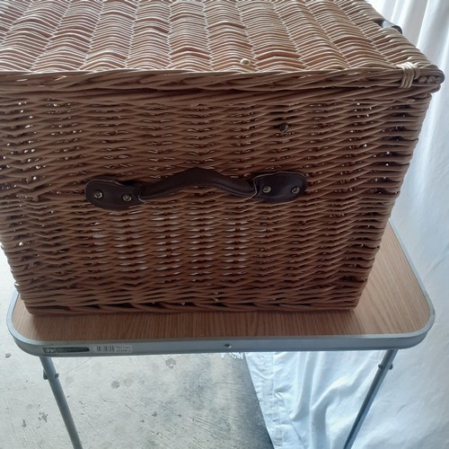 14 - Large lidded wicker basket. Leather handles and straps with buckles. Brass retaining chains for lid.... 